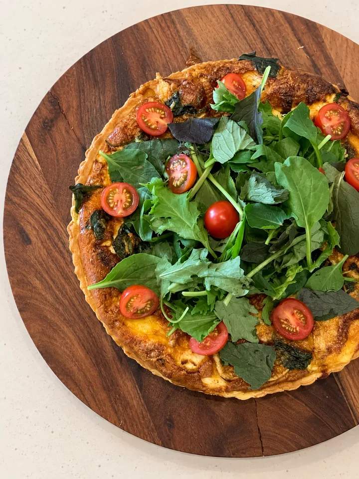 Quiche topped with greens at The Food Room